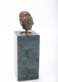 A BRASS ANTISEMITIC SCULPTURE. Probably Germany, 19th century. On a marble base with a hasidic man's