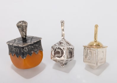 A GROUP OF THREE DREIDELS BY MICHAEL ENDE AND OTHERS.