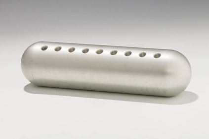 AN ALUMINUM MENORAH BY ZELIG SEGAL