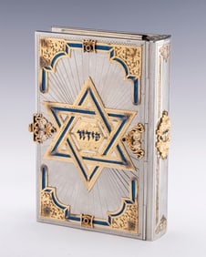 A STERLING SILVER, ENAMEL AND GILDED IDF SIDDUR BINDING BY YAAKOV DAVIDOFF.