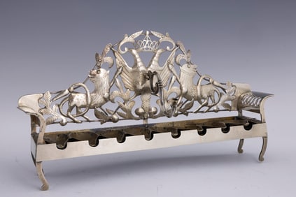 A MAGNIFICENT GALICIAN SILVER AND MIXED METAL HANUKKAH LAMP.