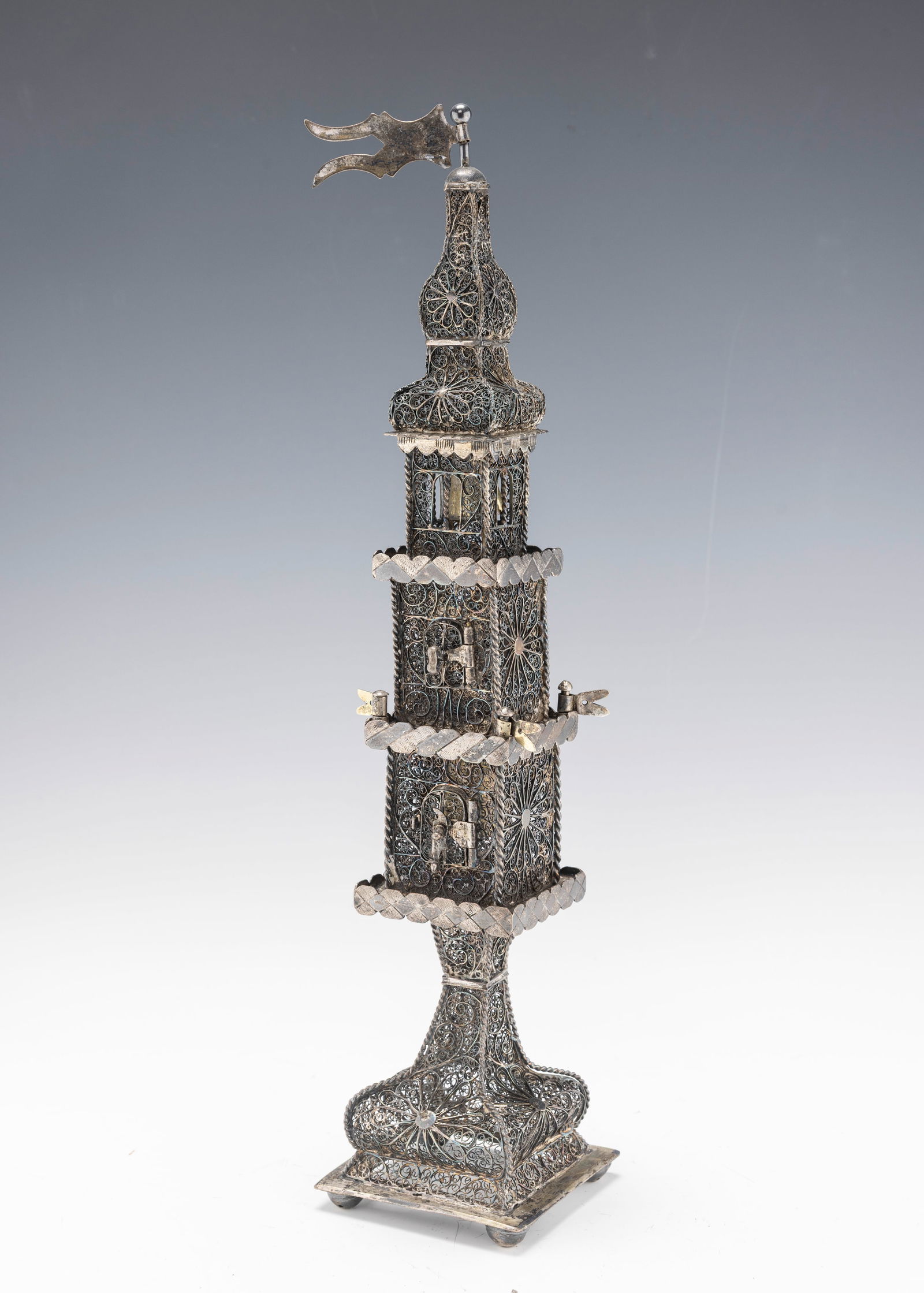 A LARGE AND IMPORTANT SILVER FILIGREE SPICE TOWER. Probably Lemberg, c. 1800: A massive spice tower, exceptionally well made. Later fitted with a pocket watch on one of the sides. Further decorated with colored stones. On a solid square base that is marked with Austro-Hungarian