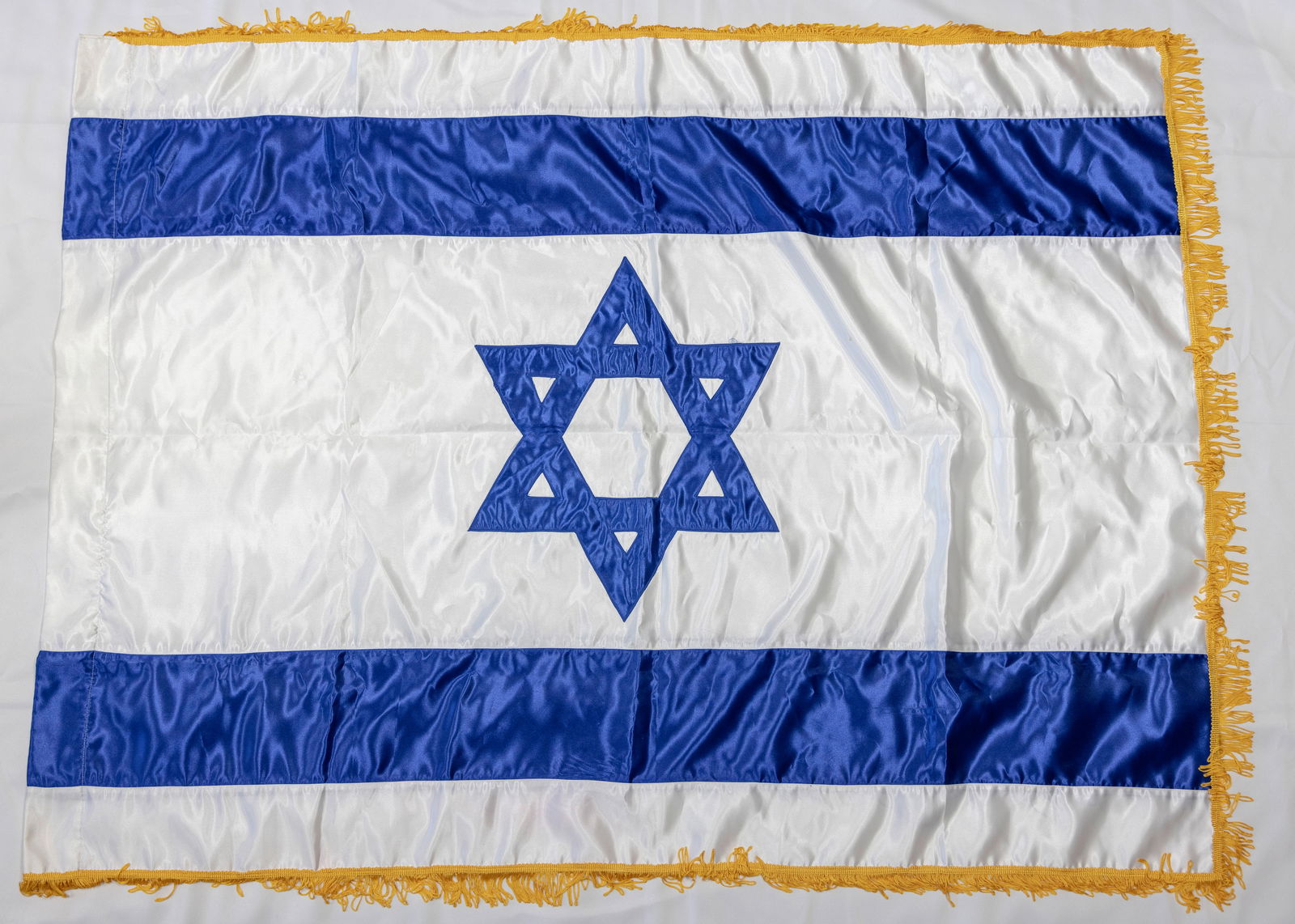 A LARGE UNUSED ISRAELI FLAG. c, 1980: Traditional. For indoor use. 88" x 60"