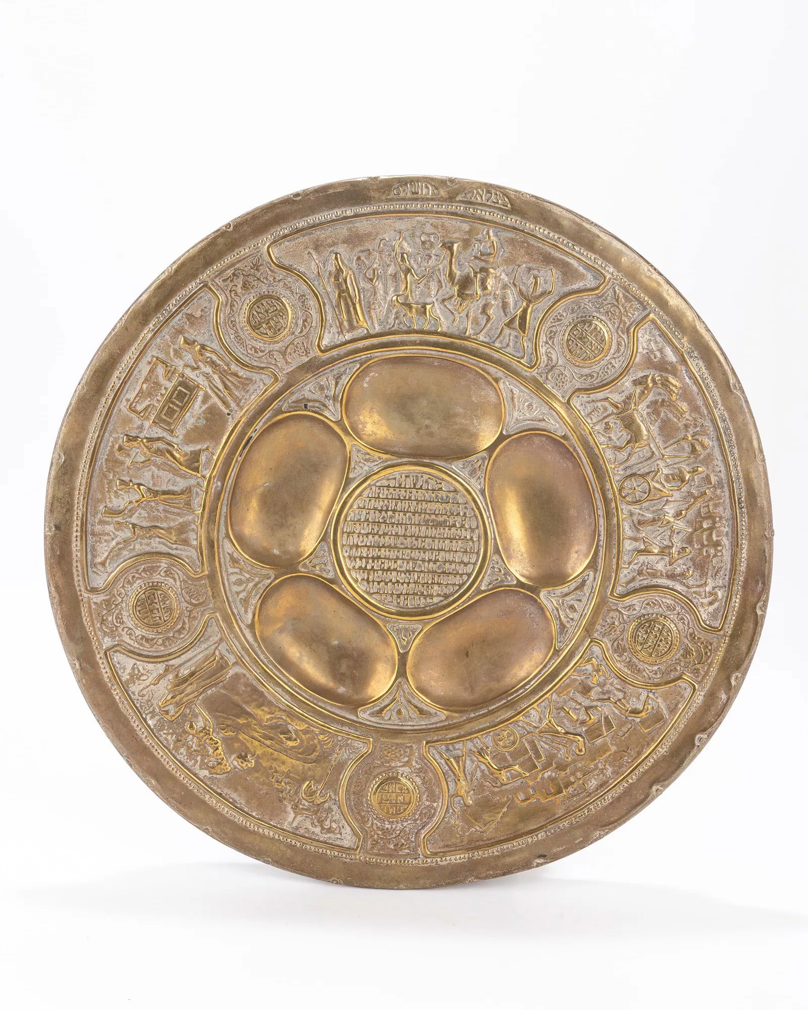 A BRASS SEDER DISH BY BEZALEL. Jerusalem, c. 1930: A BRASS SEDER DISH BY BEZALEL. Jerusalem, c. 1930 Stamped with Zev Raban designs. 13" wide
