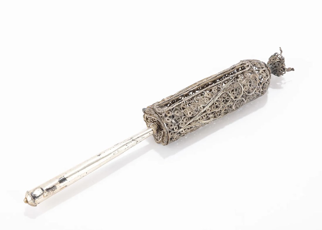 A SILVER FILIGREE MEGILLAH CASE. Ottoman Empire, c. 1860: A SILVER FILIGREE MEGILLAH CASE. Ottoman Empire, c. 1860. With a thin turning handle and a filigree body. Lacking pull tab. 9.7" long.