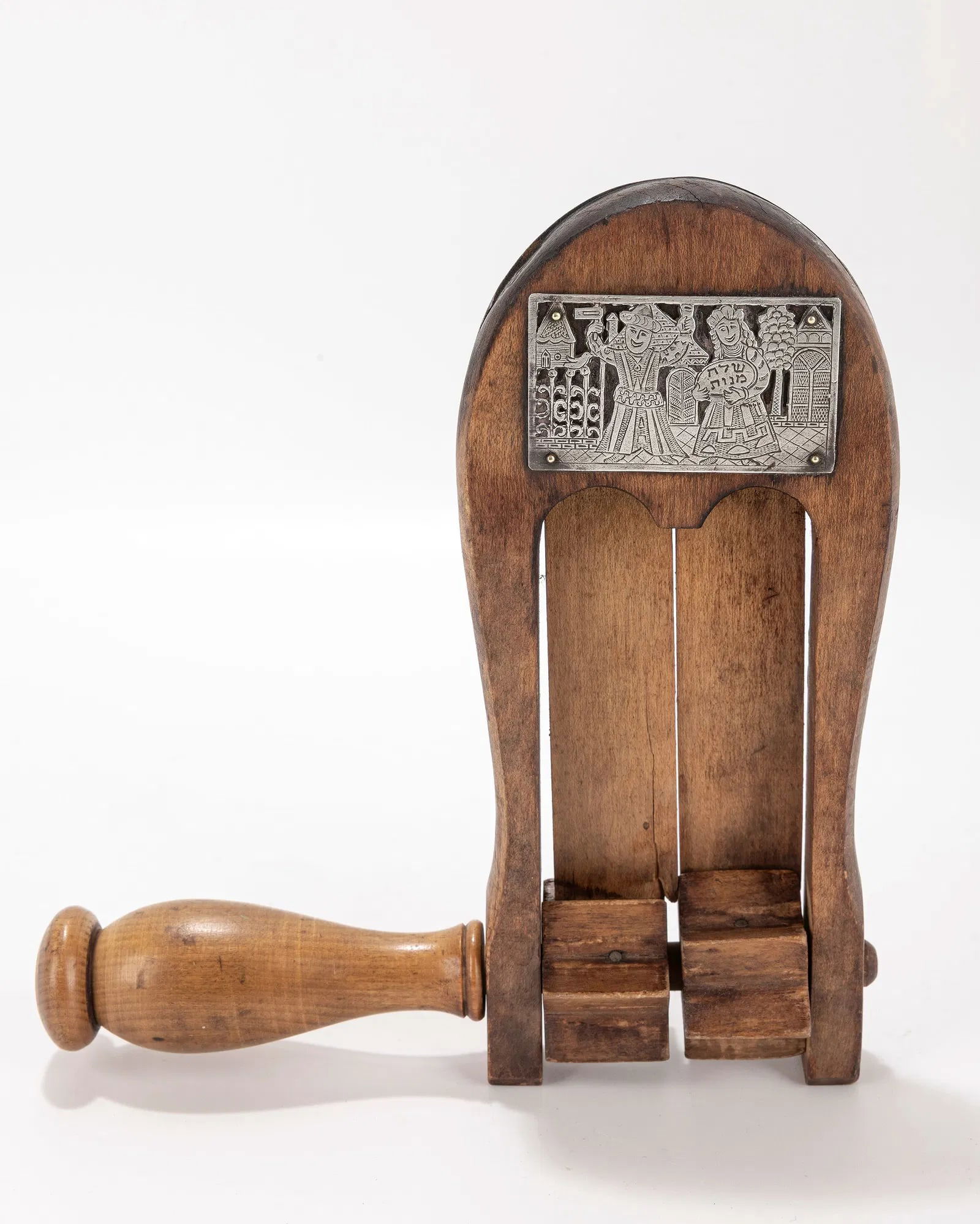 A WOODEN GRAGGER WITH SILVER APPLICATIONS. Probably American, 20th century.: A WOODEN GRAGGER WITH SILVER APPLICATIONS. Probably American, 20th century. The silver applications are in the manner of Ilya Schor. 7.5" long.