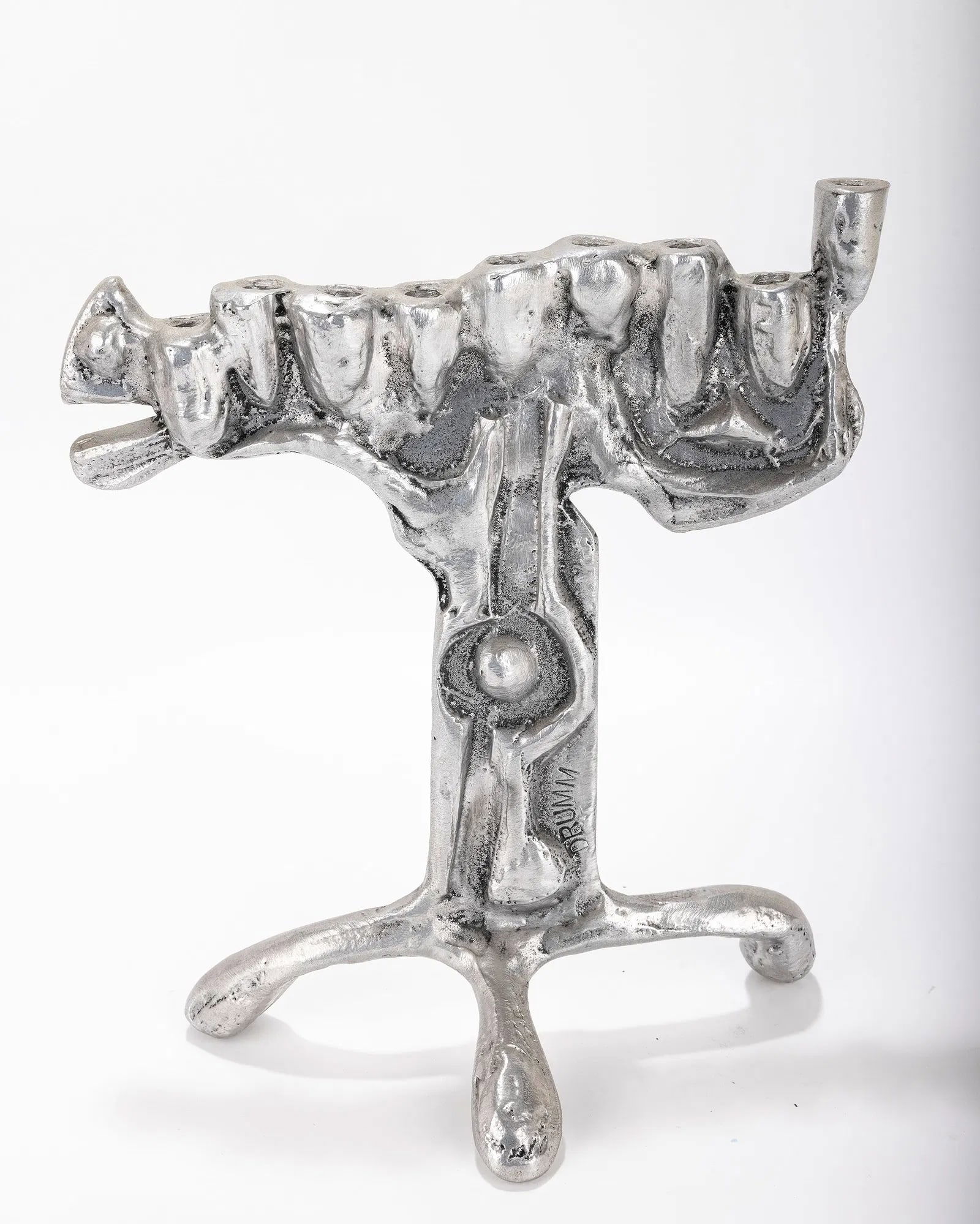 AN ALUMINUM MENORAH SCULPTURE BY DON DRUMM (American, b. 1935). (1 of 4)