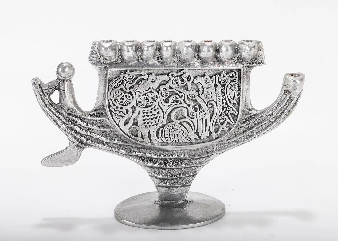 A ALUMINUM MENORAH SCULPTURE BY DON DRUMM (American, b. 1935). With an ark shaped base, (1 of 5)