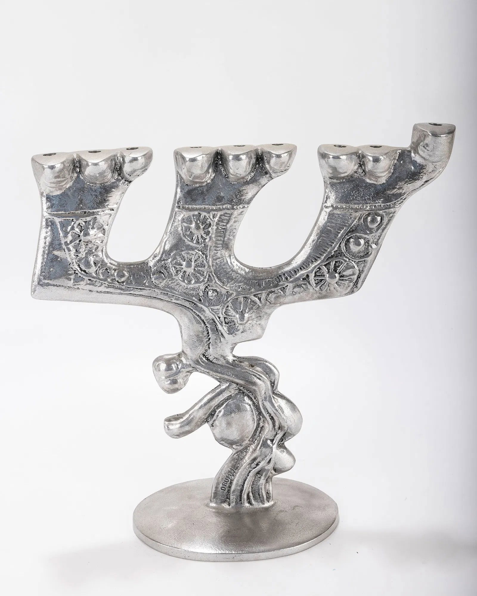 A ALUMINUM MENORAH SCULPTURE BY DON DRUMM (American, b. 1935). (1 of 4)