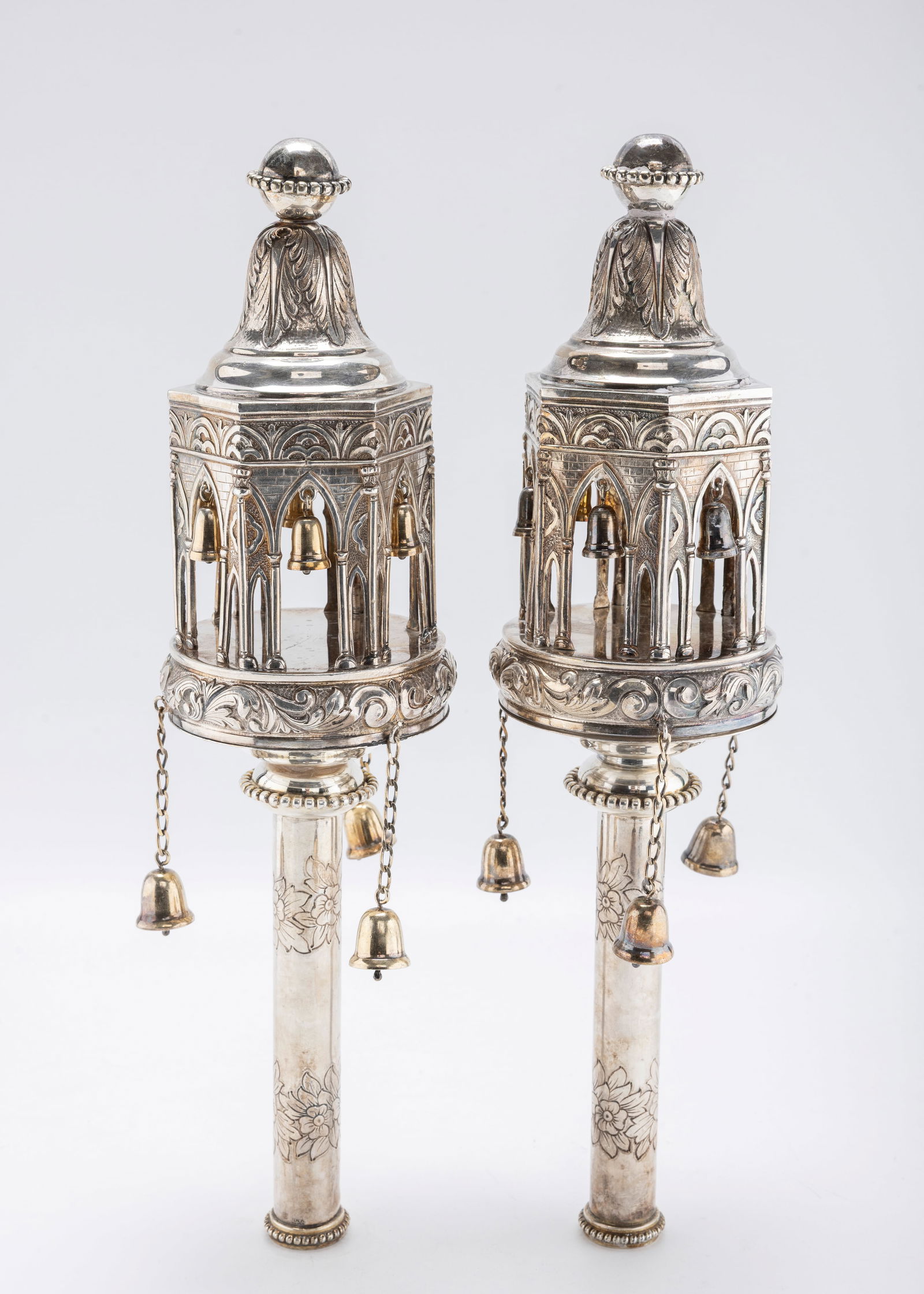A LARGE AND HEAVY PAIR OF STERLING SILVER TORAH FINIALS BY MICHAEL STRAUSS: In the style of Maurice Meyers of Paris, France. In gothic form fitted with chains and bells. Marked and signed. 1310 grams total weight. 14.8" tall each.