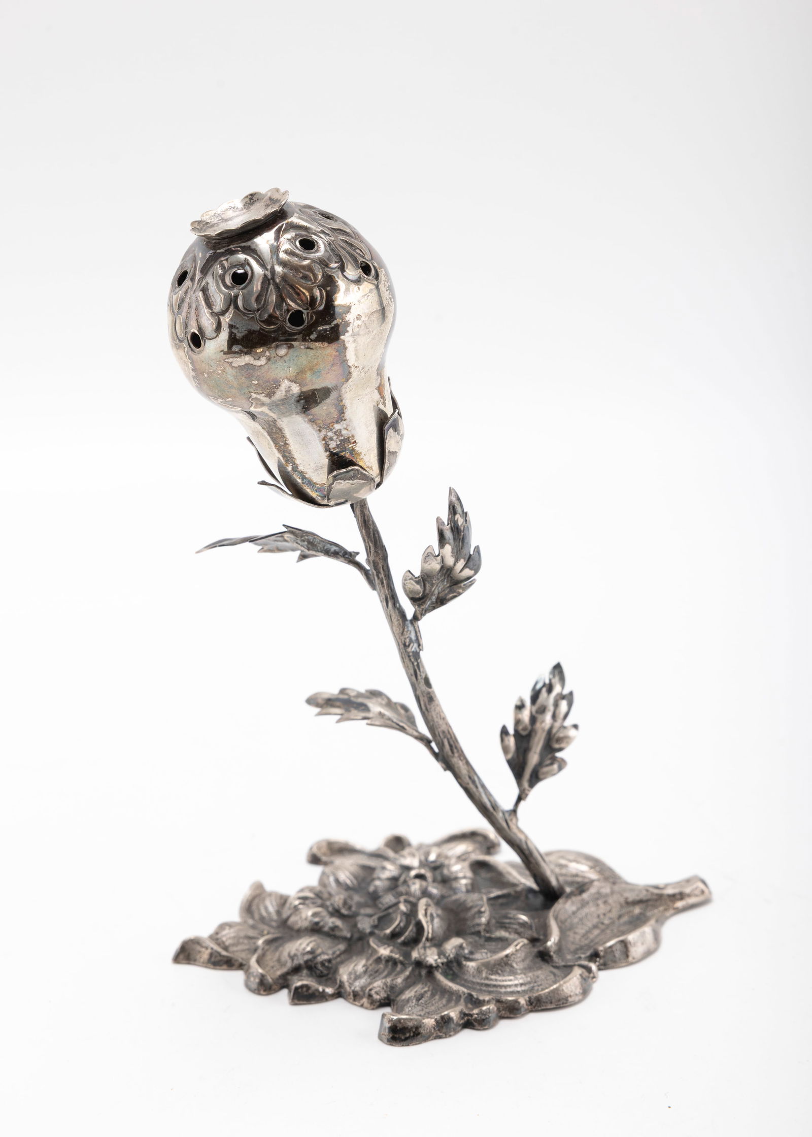 SILVER POMANDER SHAPED SPICE CONTAINER. Probably Poland, 20th century. On a floral shaped base with (1 of 2)