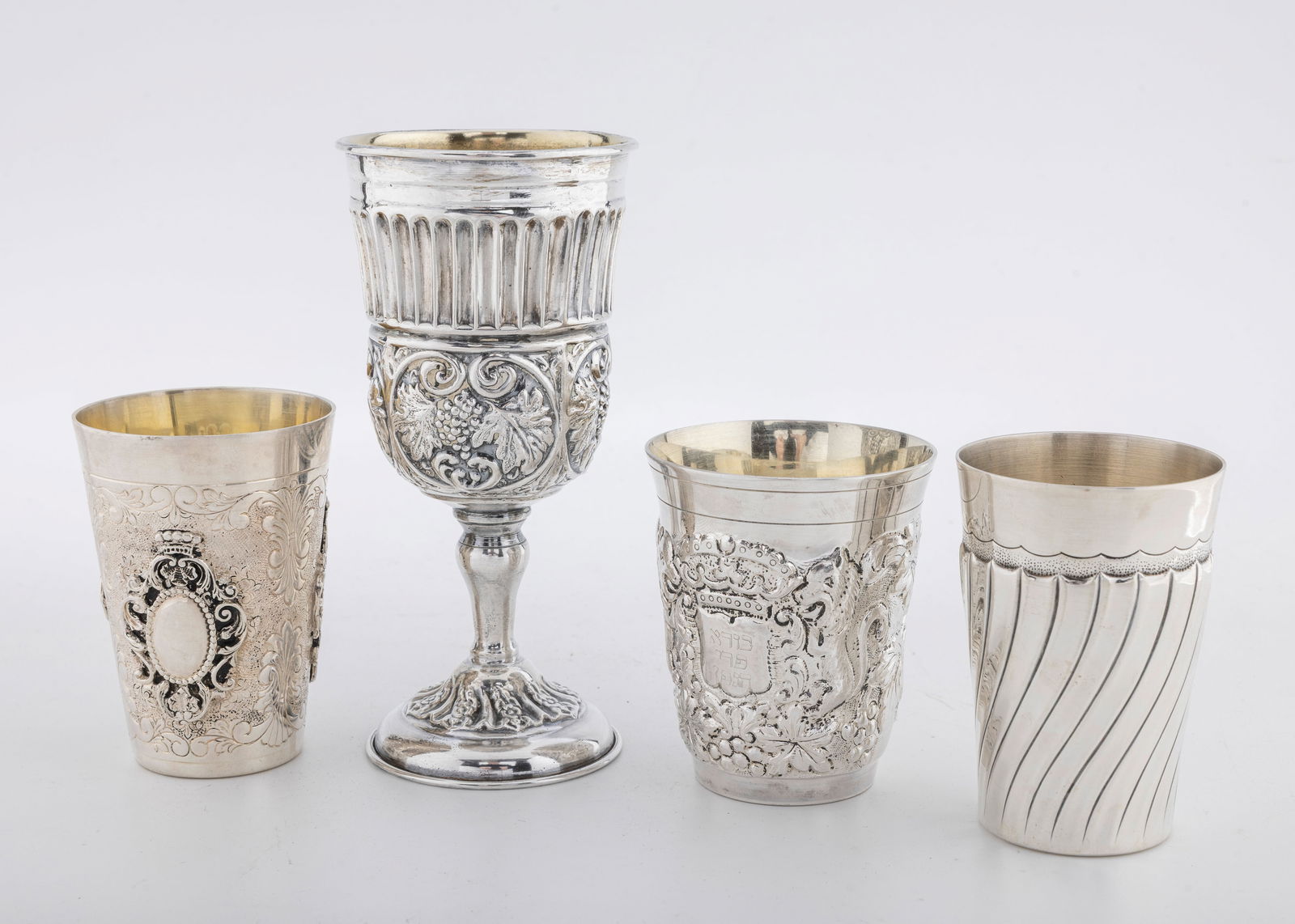 A GROUP OF FOUR STERLING SILVER KIDDUSH CUP. Israel and others. Modern. (1 of 3)