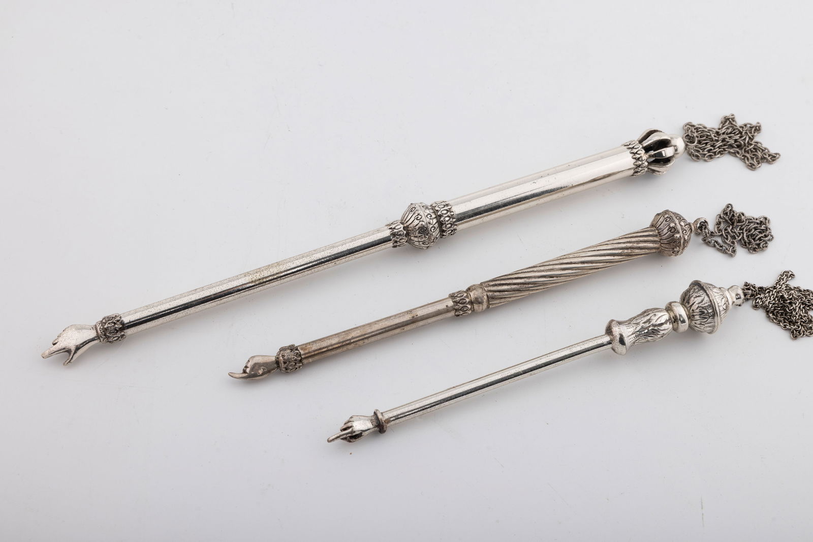 A GROUP OF THREE STERLING SILVER TORAH POINTERS (1 of 1)