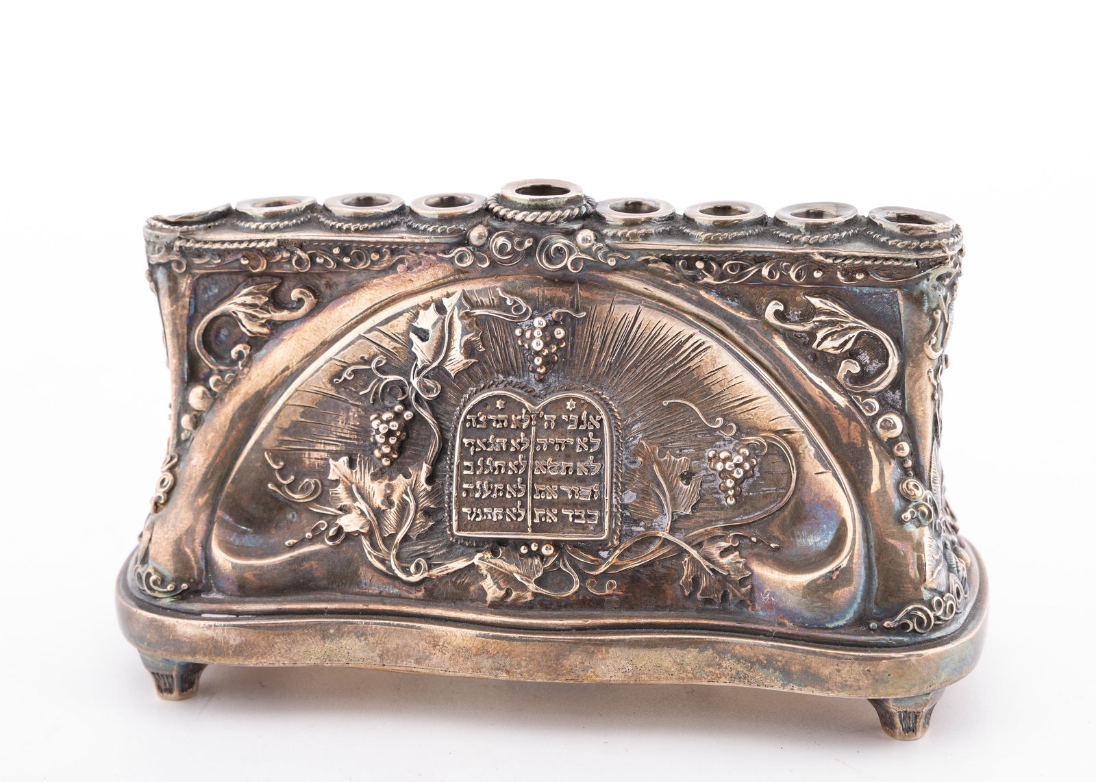 A STERLING SILVER CHANUKAH MENORAH BY HENRYK WINOGRAD. New York, 1990. (1 of 4)