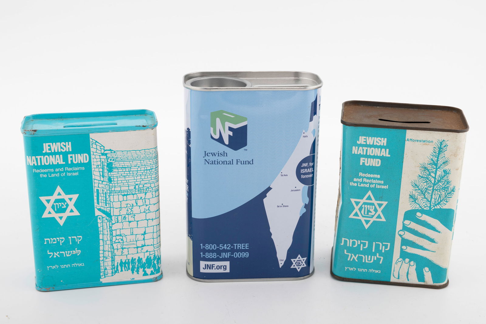 A GROUP OF JEWISH NATIONAL FUND CHARITY CONTAINERS. (1 of 2)