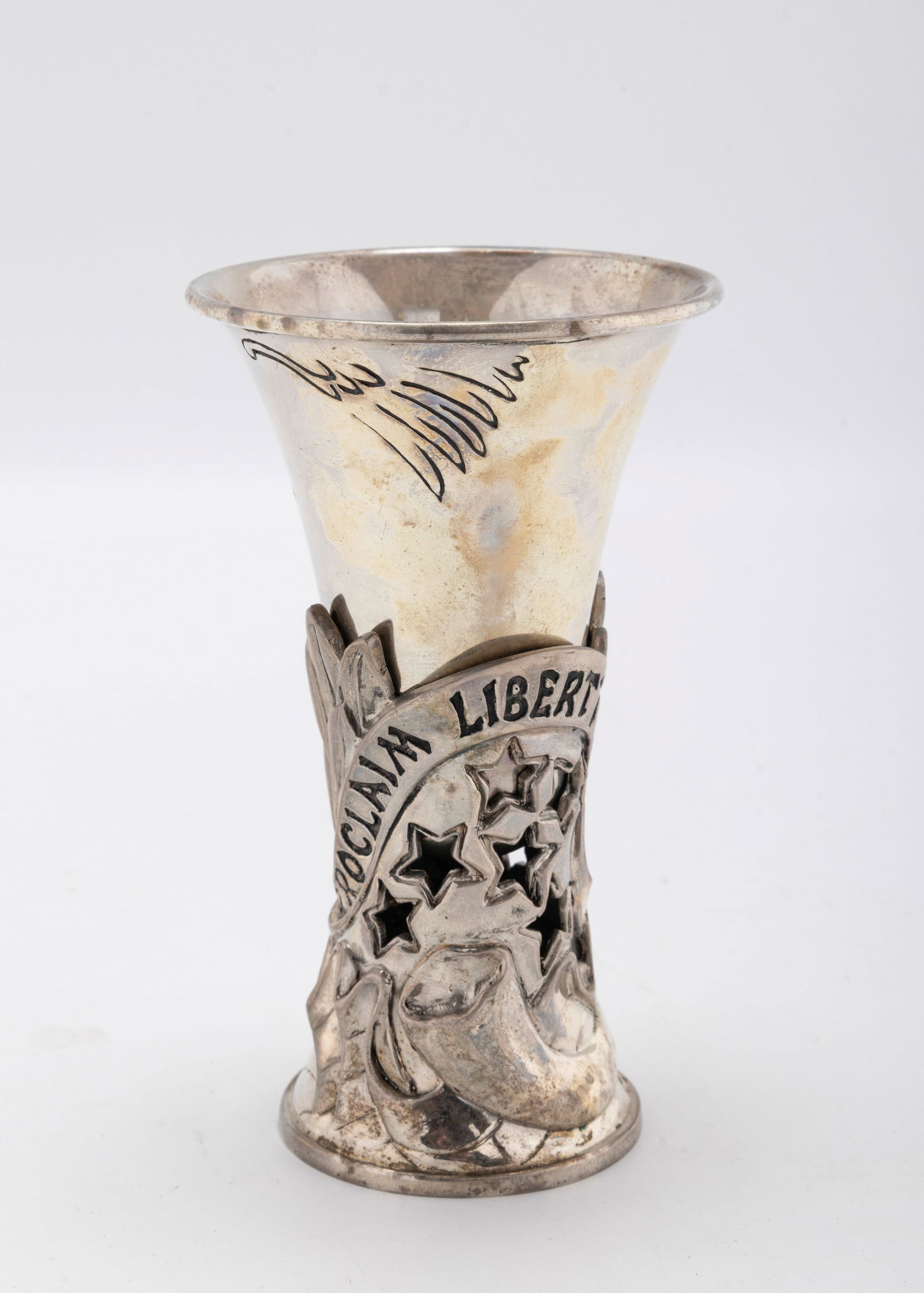 A STERLING SILVER KIDDUSH CUP. United States, 2004. Decorated with wording "PROCLAIM LIBERTY THROUGH: A STERLING SILVER KIDDUSH CUP. United States, 2004. Decorated with wording "PROCLAIM LIBERTY THROUGHOUT THE LAND" Signed. 4.7" tall. 195.8 grams