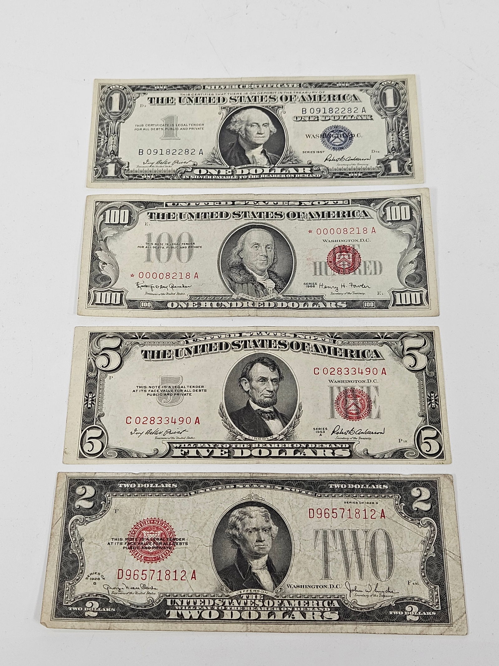 A GROUP OF AMERICAN BANKNOTES. Including a 1928 - G Red Seal , a 1953-A $5 Red Seal, a 1957 $1 silve