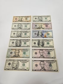 A GROUP OF AMERICAN BANKNOTES. Uncirculated. Including a 2006 $5, 2004A $10, (2) 2006 $5, 1999 $5,