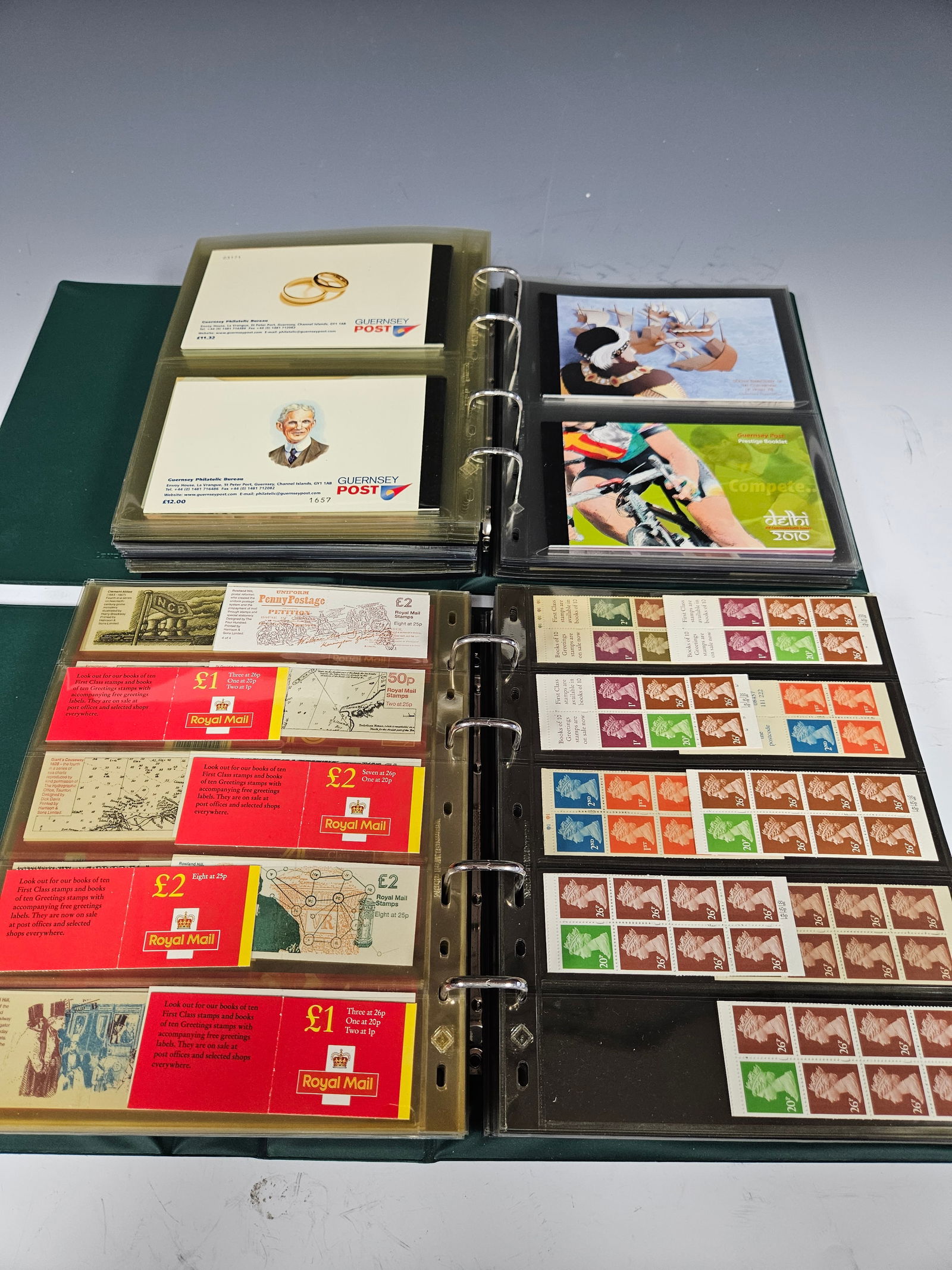 WORLD STAMPS: Containing unused booklets from Great Britain, Gibraltar, Guernsey, Hong Kong, Scotlan: WORLD STAMPS: Containing unused booklets from Great Britain, Gibraltar, Guernsey, Hong Kong, Scotland, Ireland and others. Hosted in two albums, several hundred dollars in face value. Estimate $600 -