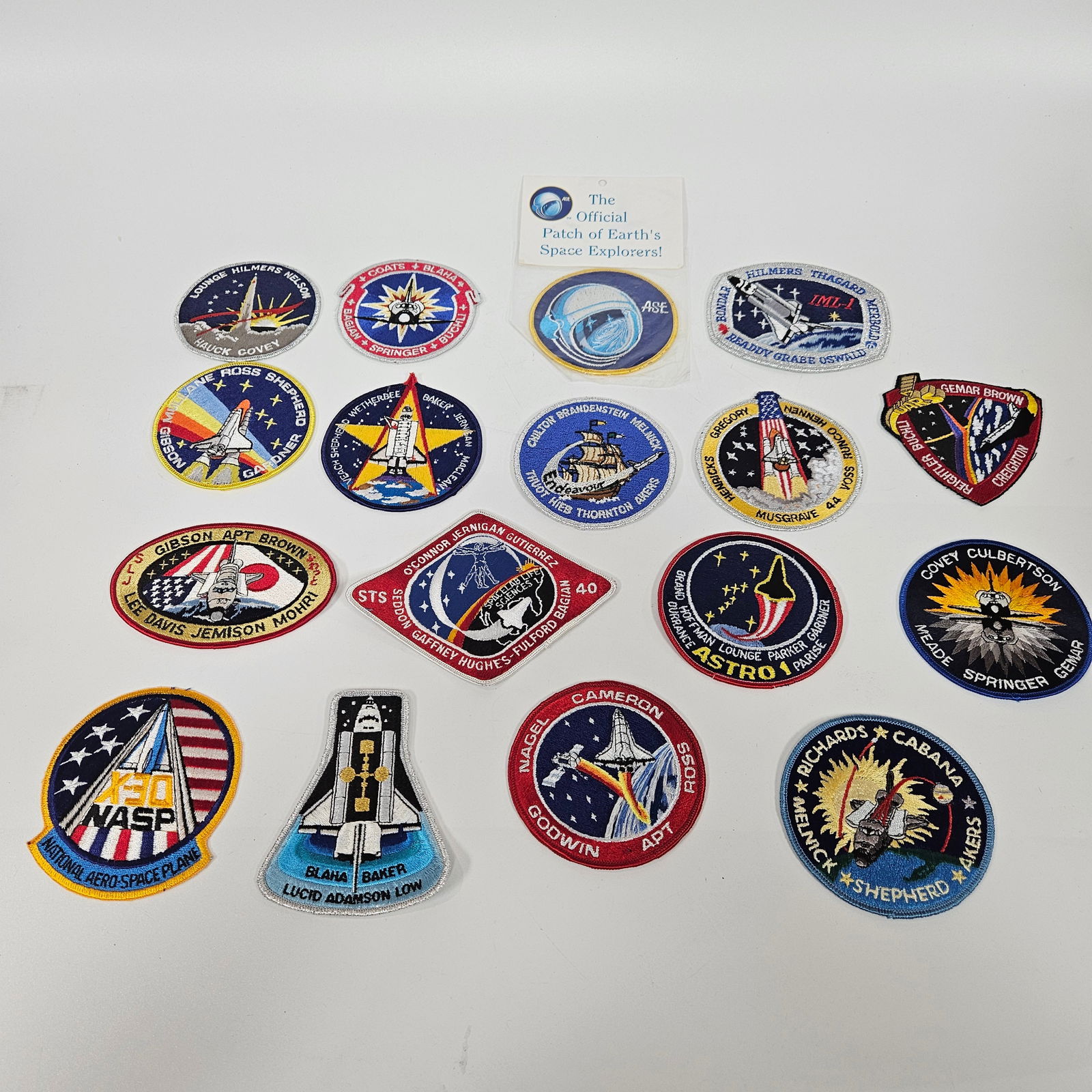 A GROUP OF 33 AEROSPACE DECORATIVE JACKET PATCHES. In multiple shapes and spanning the late 20th and: A GROUP OF 33 AEROSPACE DECORATIVE JACKET PATCHES. In multiple shapes and spanning the late 20th and early 21st centuries. Estimate $100 - 200