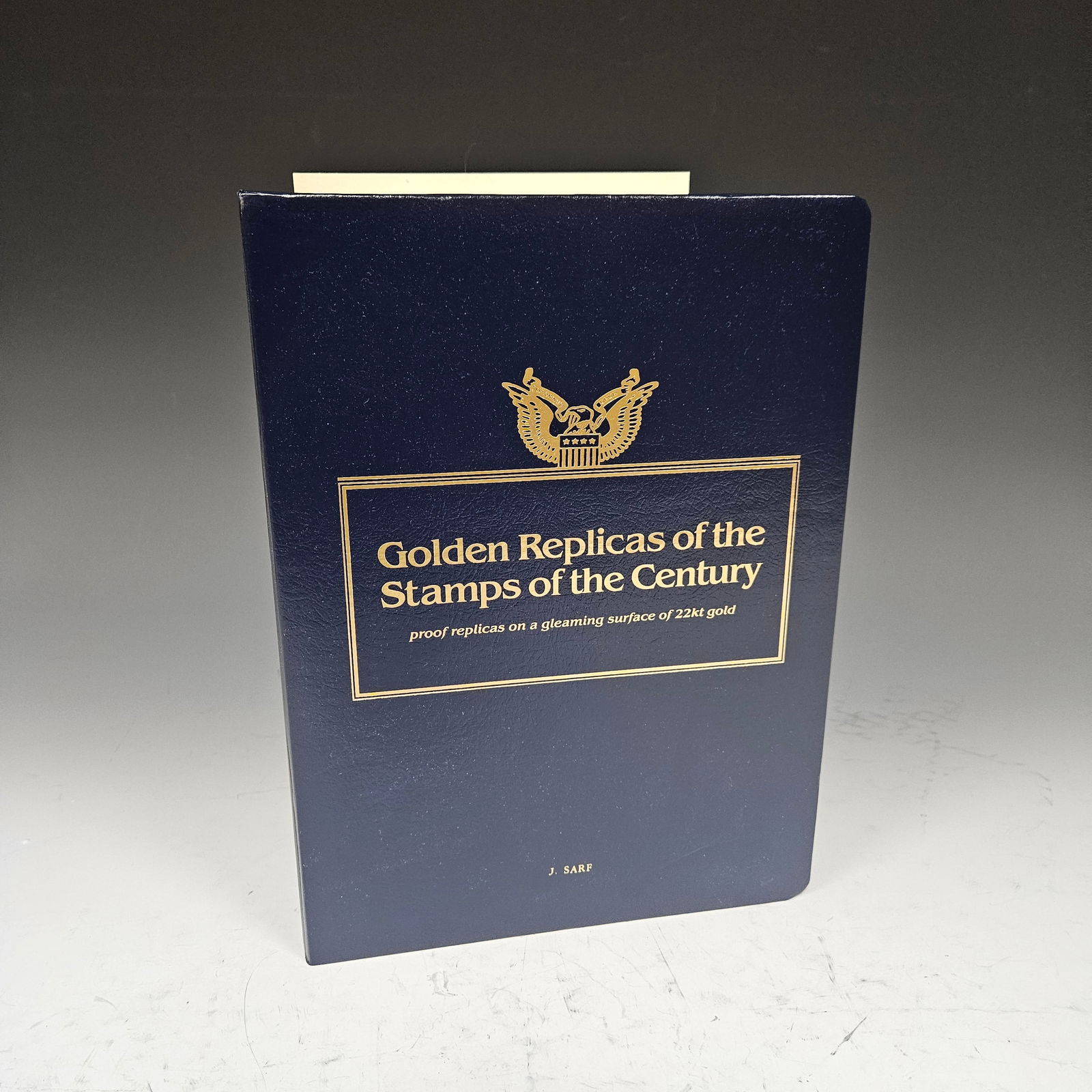 A COLLECTION OF 9 22K GOLDEN STAMPS. Housed in an album. Printed by the Postal commemorative society (1 of 12)