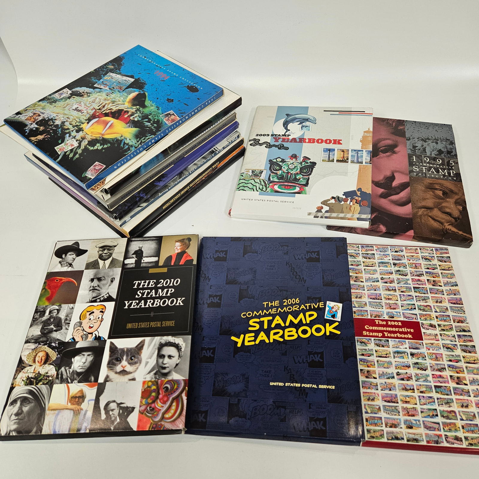 A COLLECTION OF 11 UNITED STATES YEARLY COMMEMORATIVE STAMP COLLECTIONS. Including 1994 - 1997, 1999 (1 of 5)