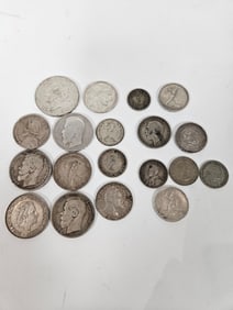A GROUP OF WORLD SILVER COINS
