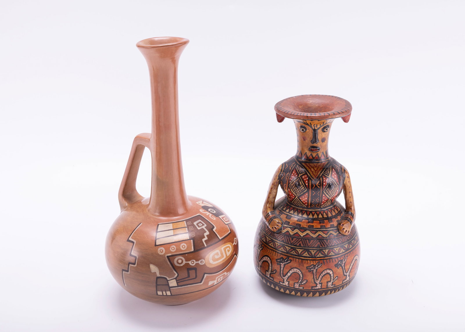 TWO SOUTH AMERICAN POTTERY VASES. 20th century: The first (10" tall) was made in Bolivia by Al Taplano, the second (7.5" tall) by Alfredo Amari in Lima, Peru