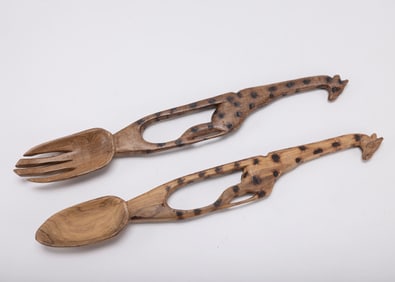 A HAND CARVED SALAD SET. Probably African, 20th century.