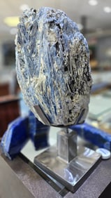 A MASSIVE KYANITE FORMATION ON A STAND
