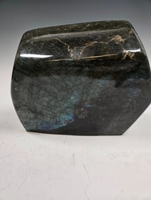 A MASSIVE POLISHED LABRADORITE SPECIMEN.
