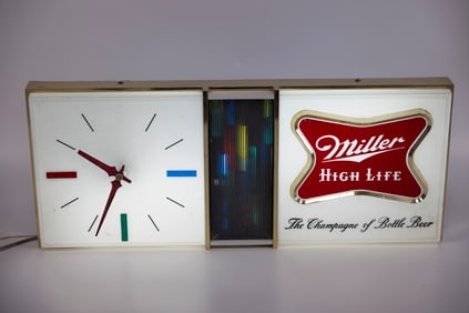A MILLER HIGH LIFE LIGHTER CLOCK SIGN. United States, c. 1960