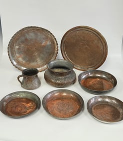 A COLLECTION OF EIGHT HAND WROUGHT BOWLS  WALL PLATES AND OTHERS