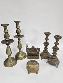 A MASSIVE PAIR OF BRASS CANDLESTICKS AND A HANUKKAH MENORAH