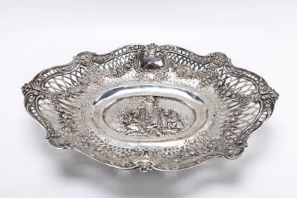 A LARGE GERMAN 800 SILVER FRUIT BASKET CHERUB SCENE.