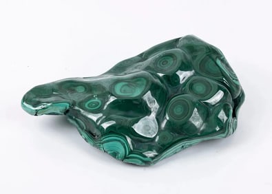 A POLISHED BULLSEYE MALACHITE SPECIMEN