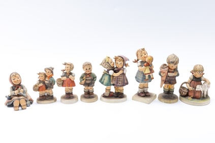 A GROUP OF EIGHT PORCELAIN HUMMEL  FIGURINES. West Germany, c. 1960