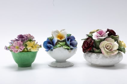 A COLLECTION OF THREE FLORAL ARRANGEMENTS OF BONE CHINA. England, early 20th century.