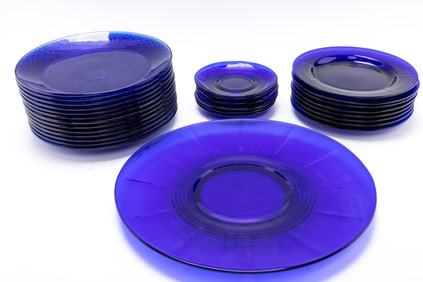 A LARGE COLLECTION OF BLUE GLASS PLATES.