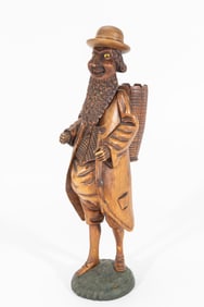 A HAND CARVED PIPE HOLDER. Continental, probably 19th century.