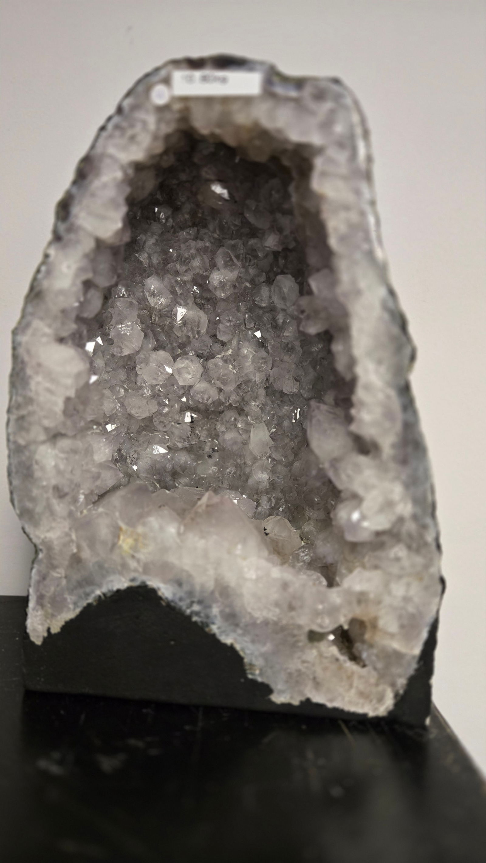 AMETHYST GEODE WITH POLISHED EDGES CATHEDRAL: Clear/gray in color. Polished edge. Triangular in shape. 12" tall and 10.8 kilograms