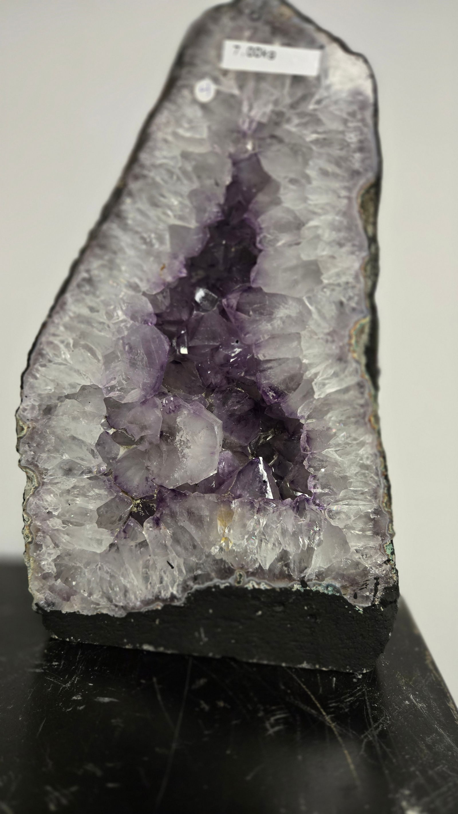 AMETHYST GEODE WITH POLISHED EDGES CATHEDRAL: Light purple in color. Polished edge. Triangular in shape. 11.5" tall and 7 kilograms