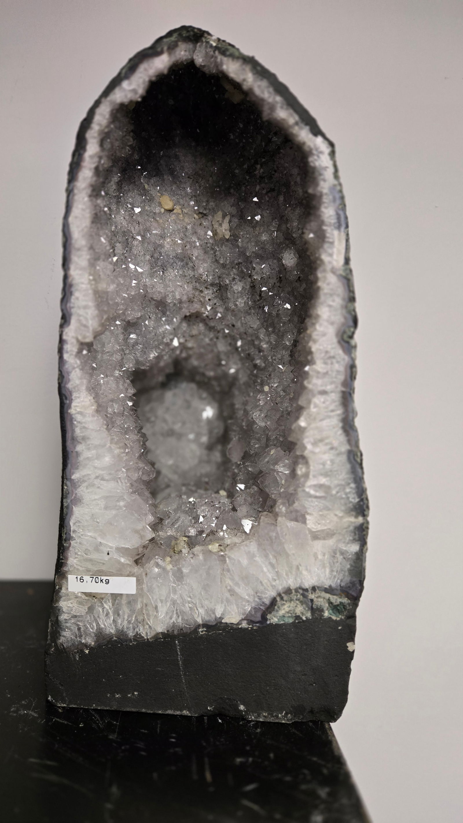 AMETHYST GEODE WITH POLISHED EDGES CATHEDRAL: Light purple in color. Polished edge. Triangular in shape. 15" tall and 16.7 kilograms. Small piece missing from the top