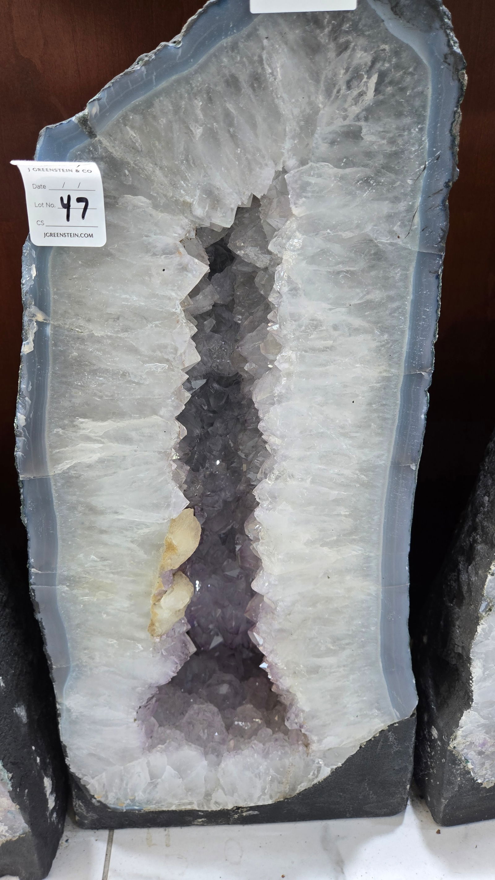 A LARGE AMETHYST CATHEDRAL POLISHED EDGES: Light in color. With a nice soft blue polished rim. 19" and 25 kilograms