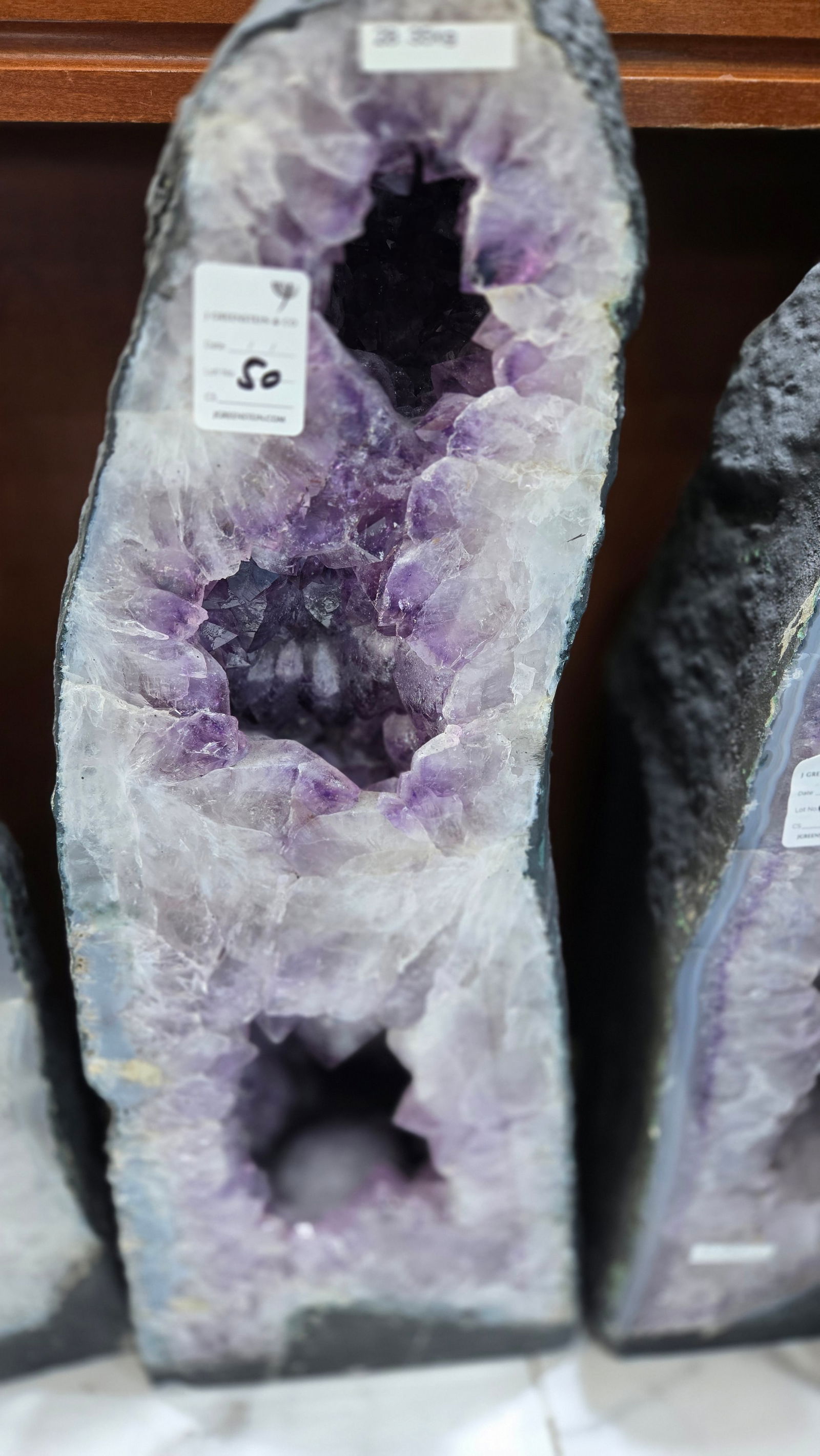 A LARGE AMETHYST CATHEDRAL POLISHED EDGES: Deep purple in color. With a nice soft blue polished rim. kilograms and 22" tall.