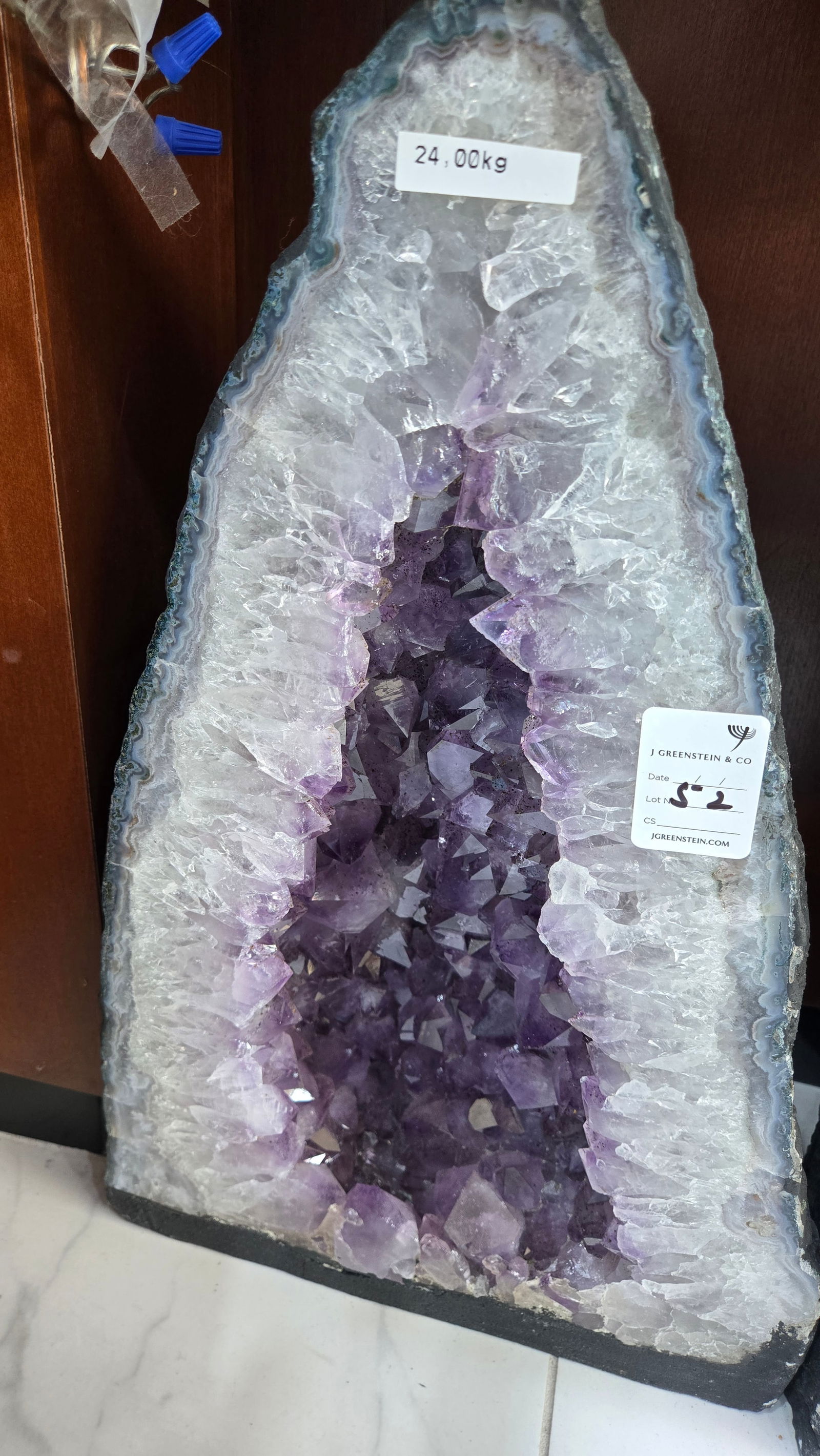 A LARGE AMETHYST CATHEDRAL POLISHED EDGES: light purple in color. With a nice soft blue polished rim. 24 kilograms and 17" tall.