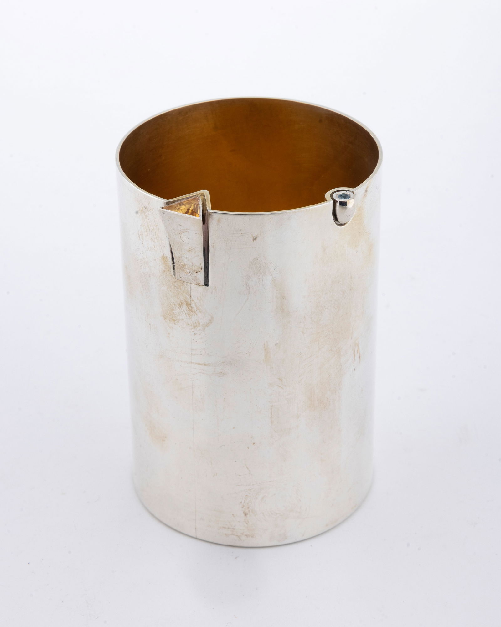 A STERLING SILVER KIDDUSH CUP BY YONATAN SHALOM: Israel, Modern. Beaker form. The interior is gilded. The upper rim with applied stones. Signed. 3.8" tall and 6.58 ozt