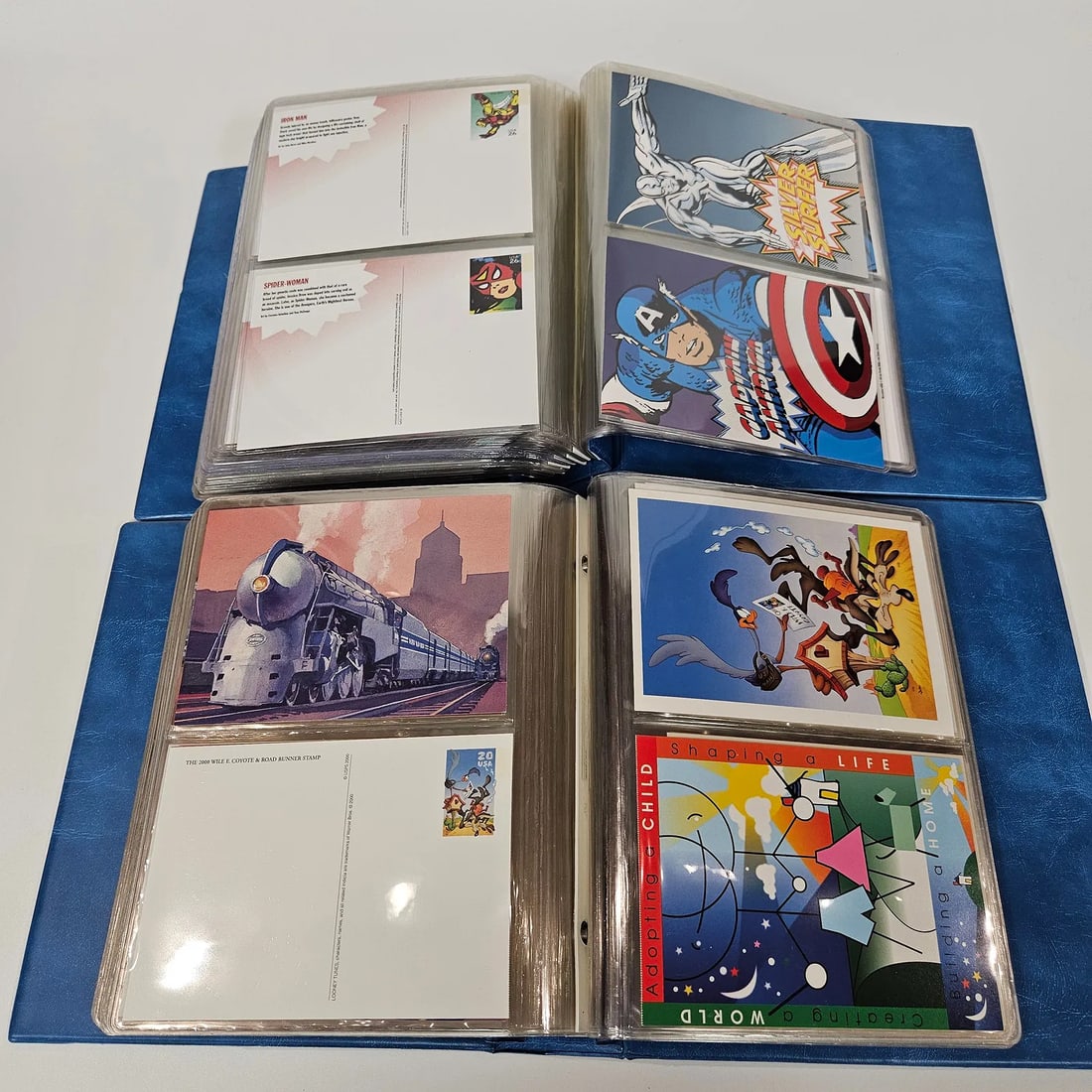 A MASSIVE COLLECTION OF ILLUMINATED FIRST DAY AND OTHER UNITED STATES POST CARDS. Approximately 400: A MASSIVE COLLECTION OF ILLUMINATED FIRST DAY AND OTHER UNITED STATES POST CARDS. Approximately 400 cards from the 1990's include topics such as the Olympics, San Diego zoo, Love, classic movies, cart