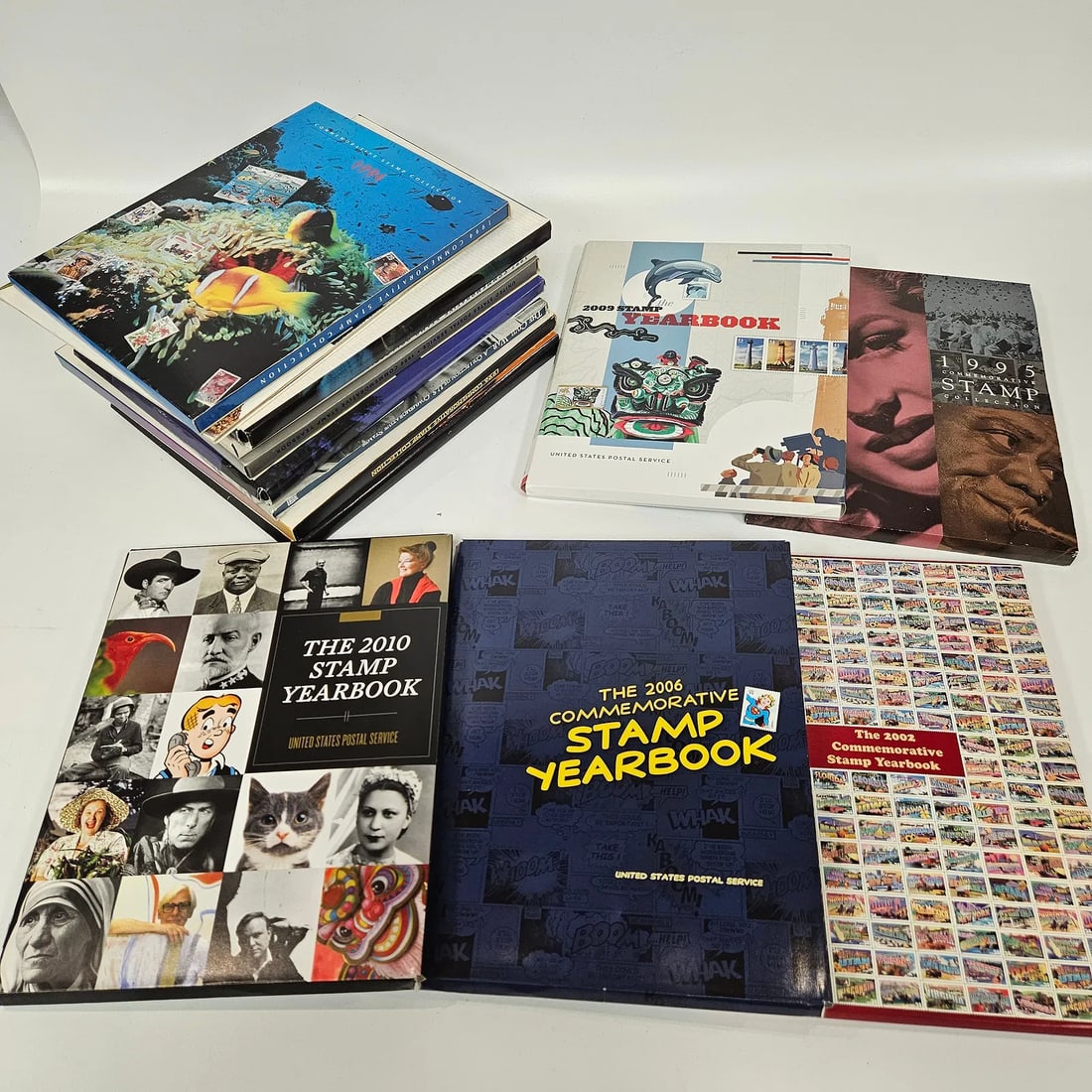 A COLLECTION OF 11 UNITED STATES YEARLY COMMEMORATIVE STAMP COLLECTIONS. Including 1994 - 1997, 1999 (1 of 5)