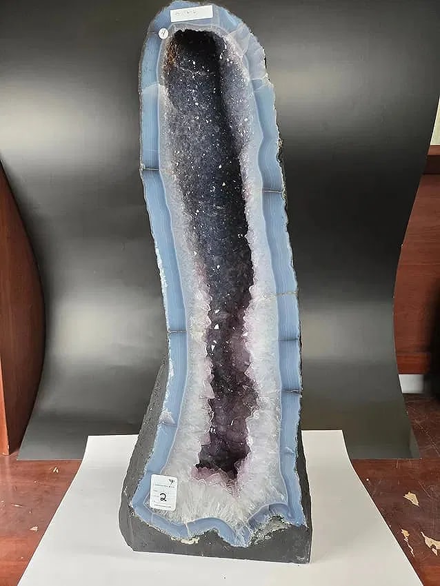 AMETHYST CATHEDRAL GEODE WITH POLISHED EDGES: 25.5" tall and 9.5" at it's widest. Weignt is 30.7 kilograms